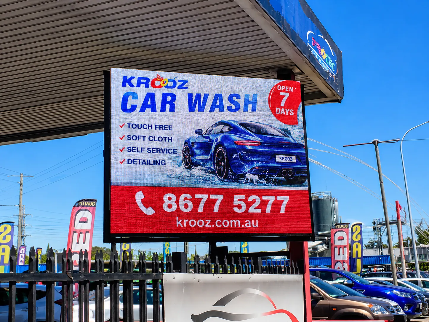 Roadside LED advertising screen installed at a car wash.